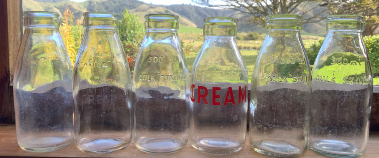 Six Vintage New Zealand half Pint Cream Bottles